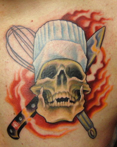 Flaming chef's skull with crossed chef's knife and whisk. A play on the ole skull & crossbones.
